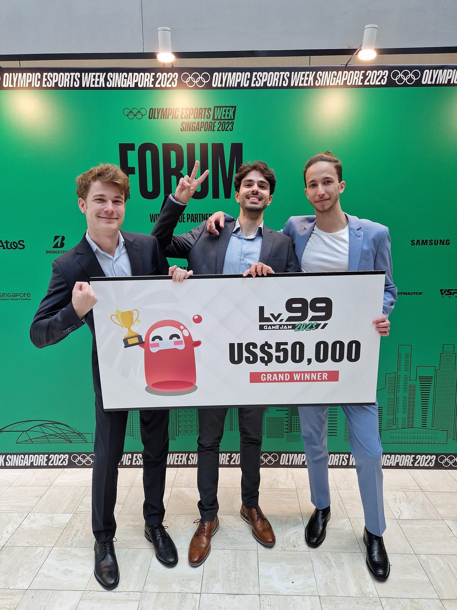 Jad Tawbi and his team with the prize check on stage at LV99 Game Jam in Singapore.
