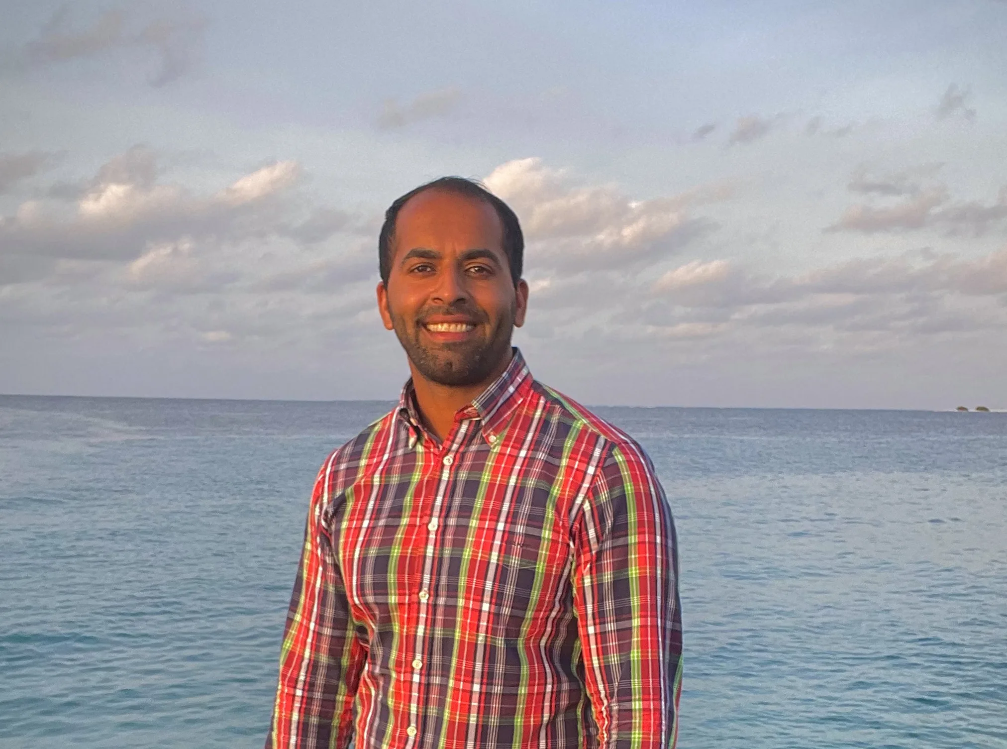 An image of Agile Project Manager Milad Omari with a scenic backdrop.